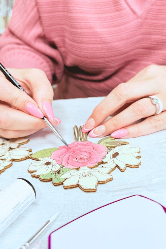 Close-up of DIY floral bouquet being painted as part of mindful craft kit for adults