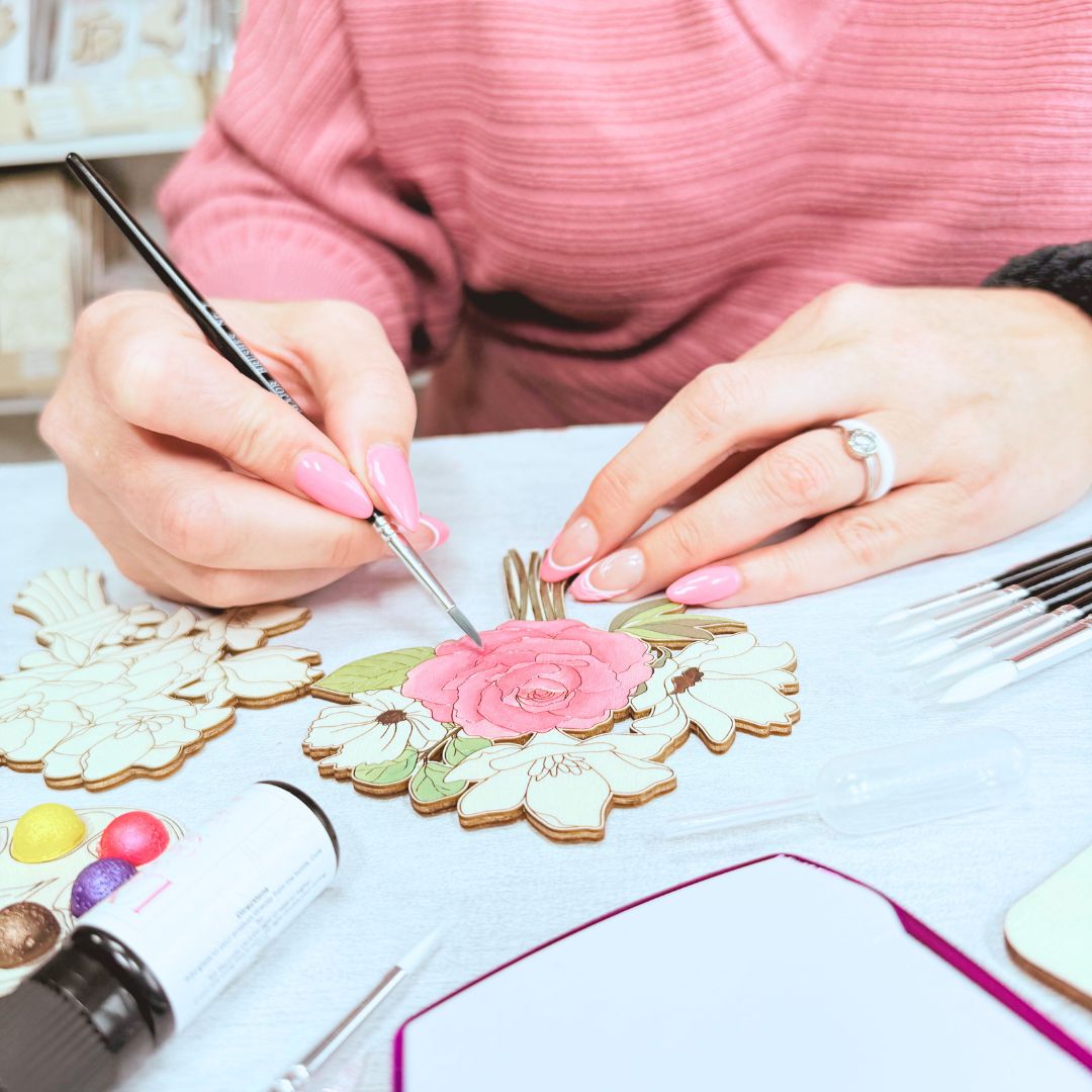 Close-up of DIY floral bouquet being painted as part of mindful craft kit for adults