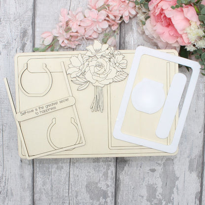 Unpainted floral vase frame craft kit pieces including wooden elements and acrylic frame