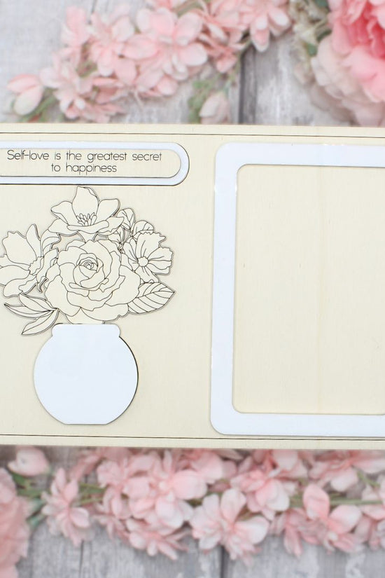 Unpainted assembled floral vase and frame craft kit ready to be painted