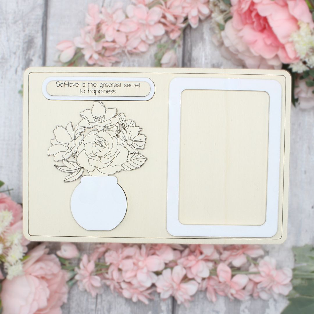 Unpainted assembled floral vase and frame craft kit ready to be painted